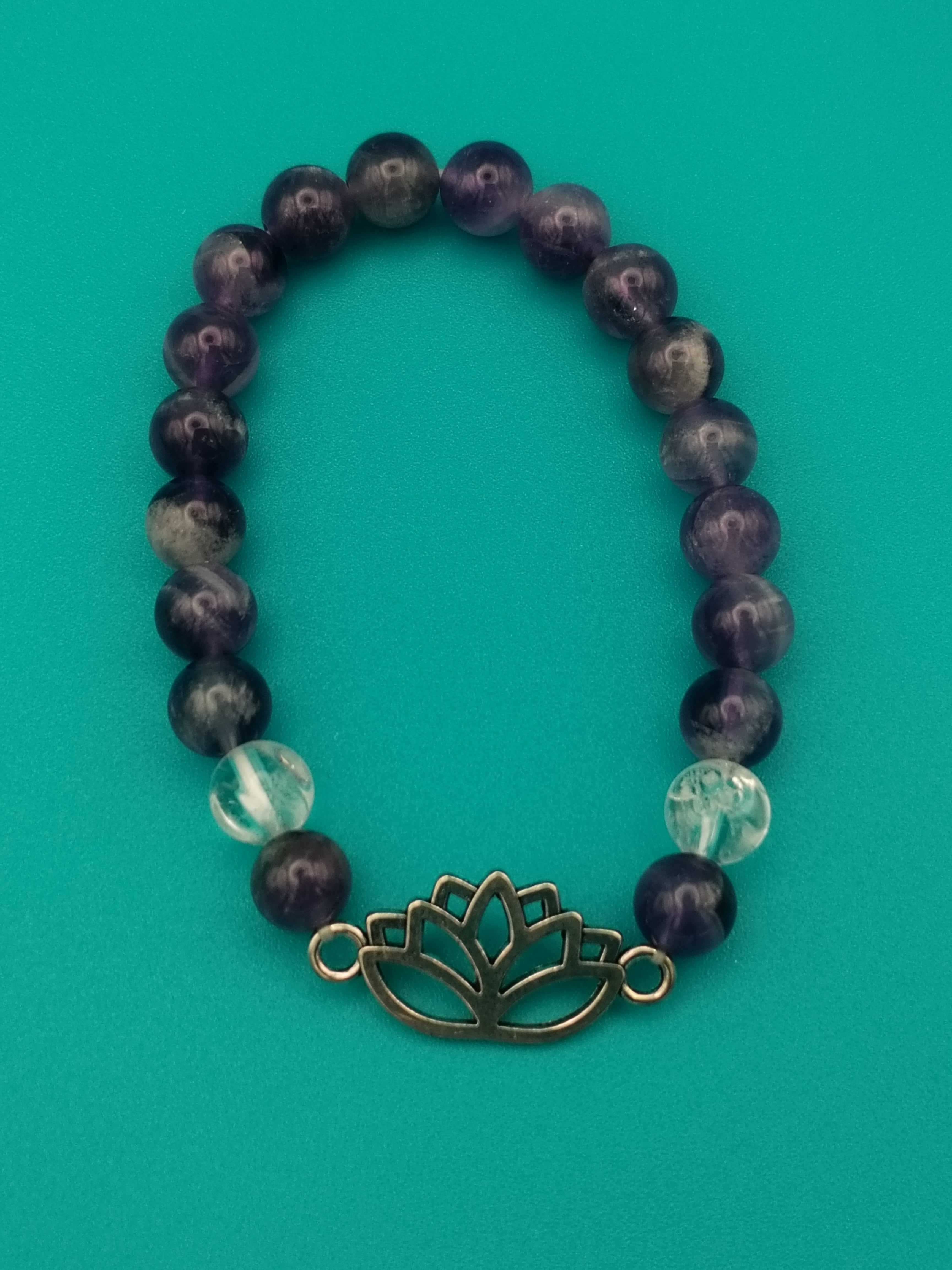 Chevron Amethyst and Rock Crystal elastic bracelet, with a charming lotus.