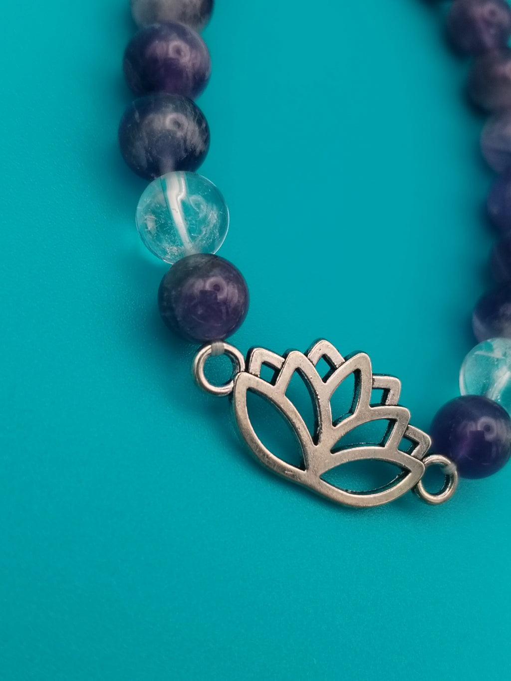 Chevron Amethyst and Rock Crystal elastic bracelet, with a charming lotus.