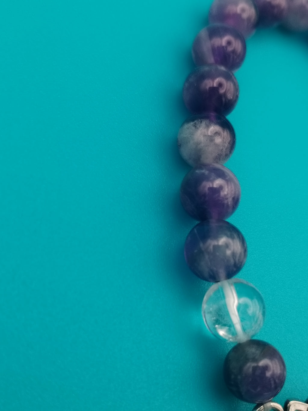 Chevron Amethyst and Rock Crystal elastic bracelet, with a charming lotus.