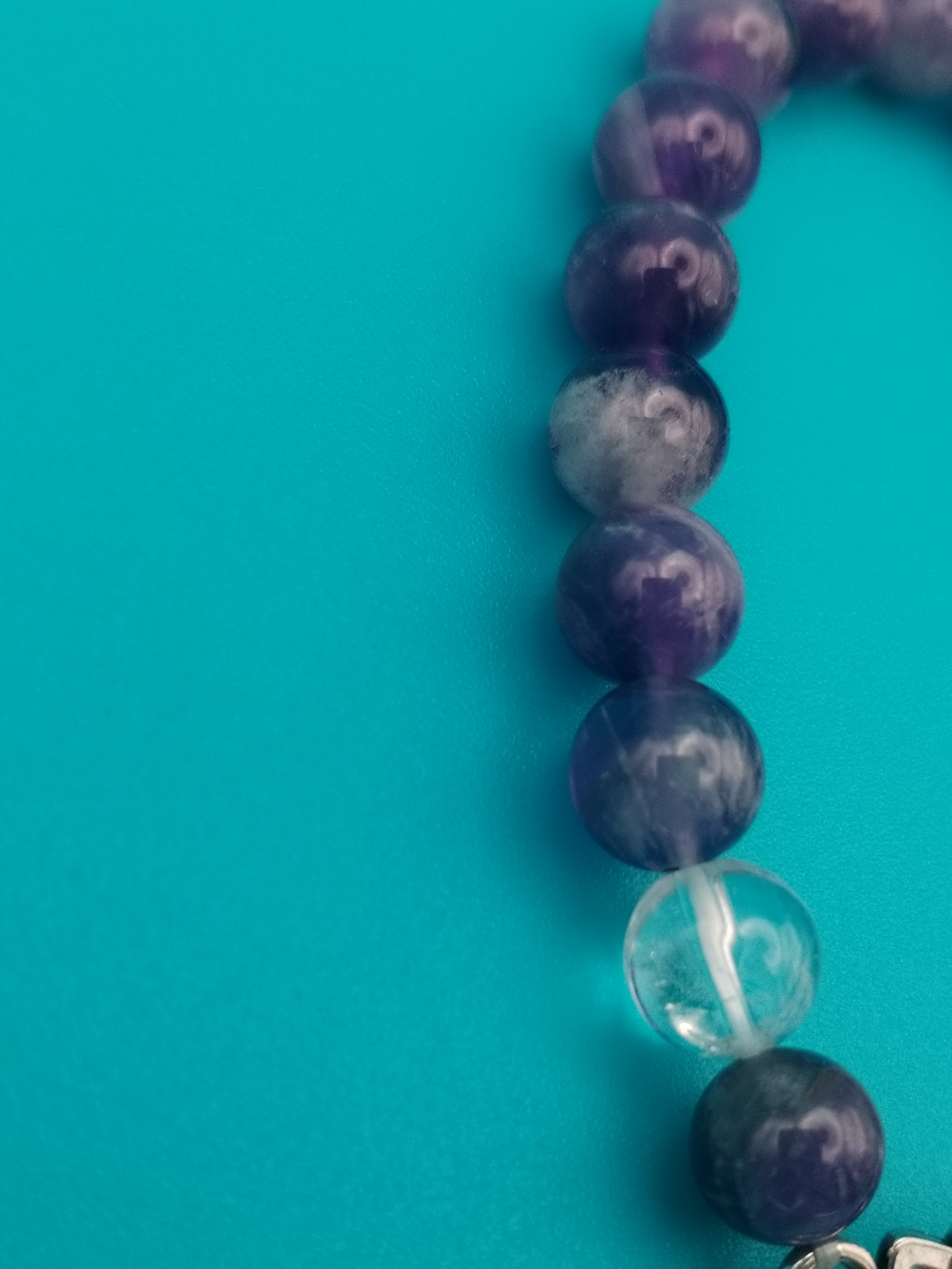 Chevron Amethyst and Rock Crystal elastic bracelet, with a charming lotus.
